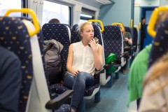 Woman travelling by train.